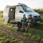 Campervan with solar panels in UK countryside