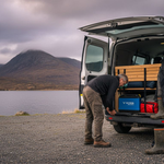 Campervan unloading with lithium battery visible