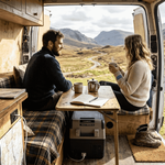 Couple using energy storage in campervan interior