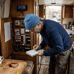 Boat owner assessing battery energy panel