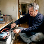 Boat owner installing lithium battery bank