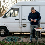 Technician prepping solar panel on campervan