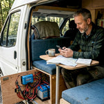 Man checking integrated campervan power system