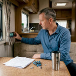 Man checking battery monitor in RV