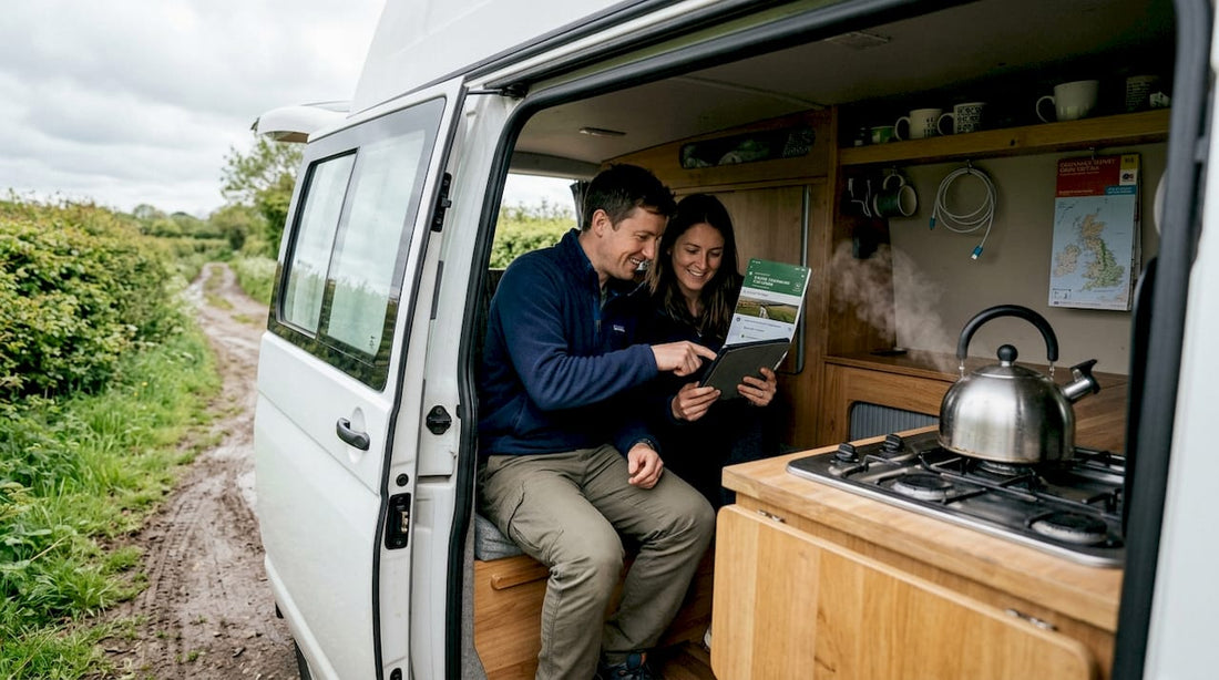 Couple managing campervan energy in rural UK setting
