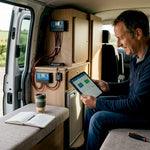 Campervan user monitoring battery with tablet