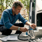 Campervan owner installing lithium battery