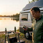 Motorhome with solar panels and man checking battery